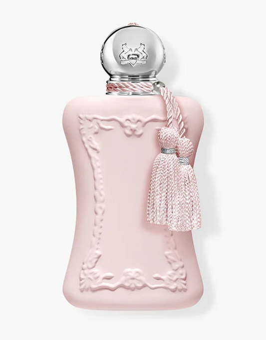Parfums de Marly Delina pink perfume bottle with decorative cap and tassel on a white background