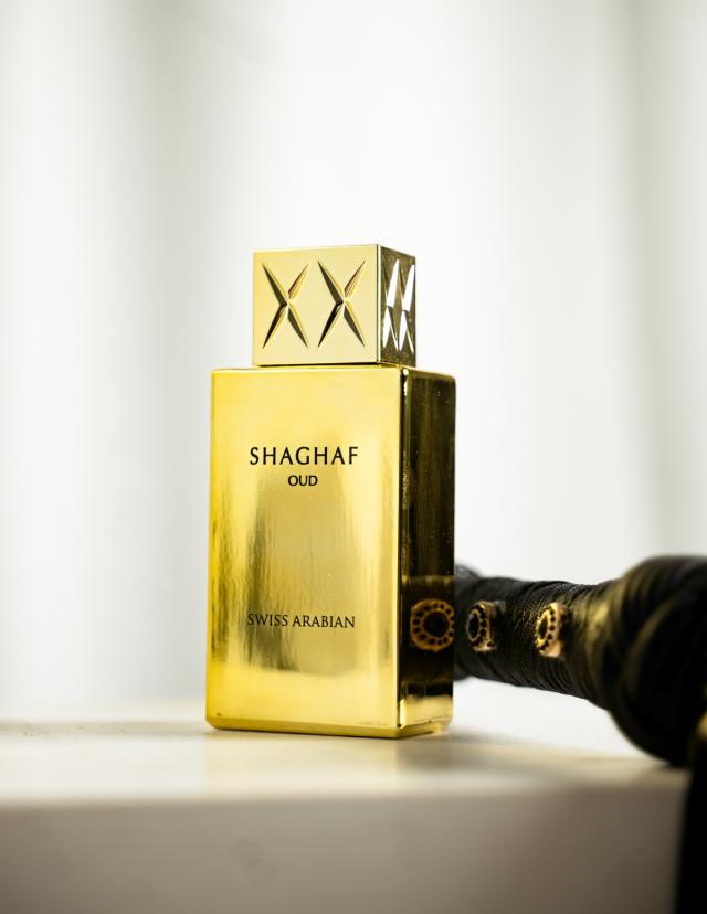 Gold SHAGHAF OUD perfume bottle with a white background